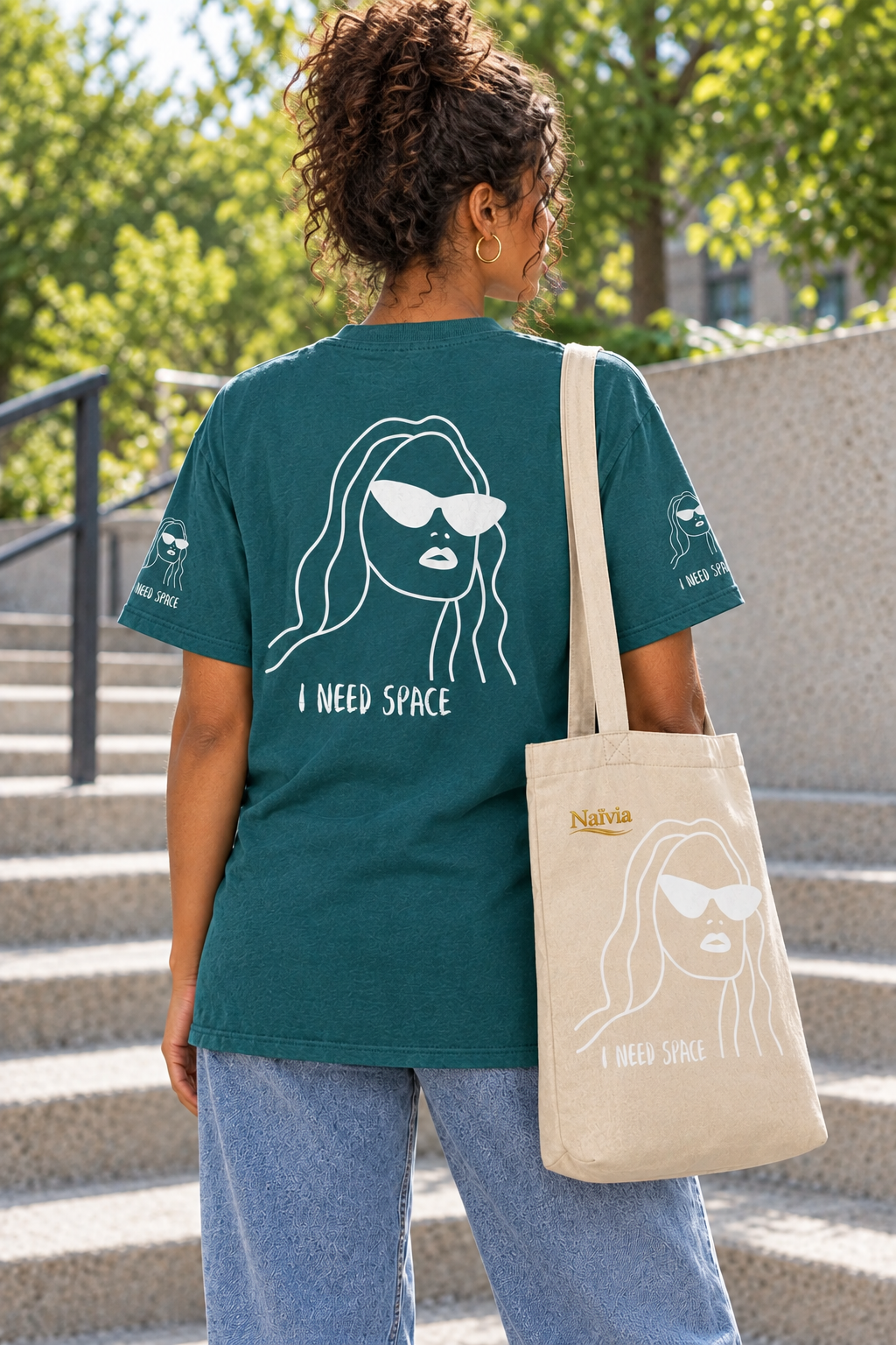 Revised back view with a natural neck position, teal T-shirt and Oyster tote